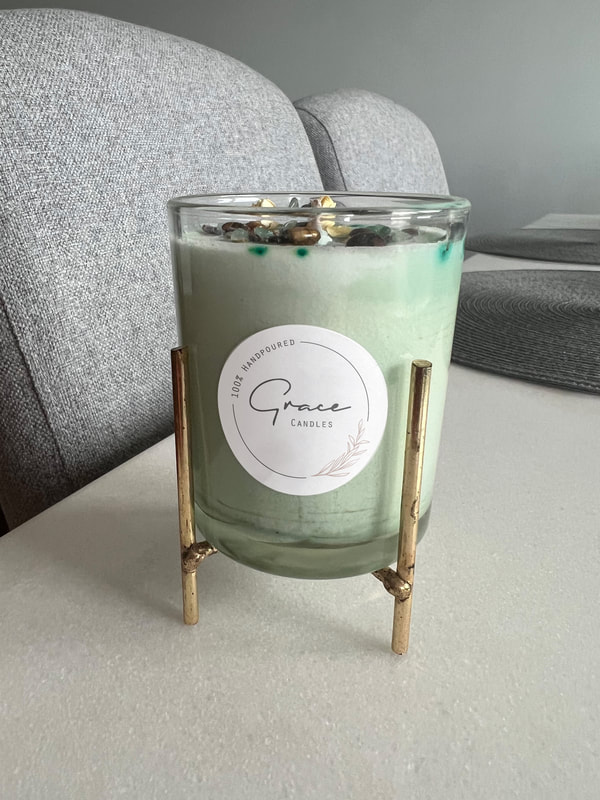 Logo design of Grace Soy Candles on one of her beautiful candle