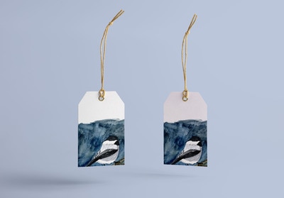 Watercolor illustration of a winter bird on a gift tag